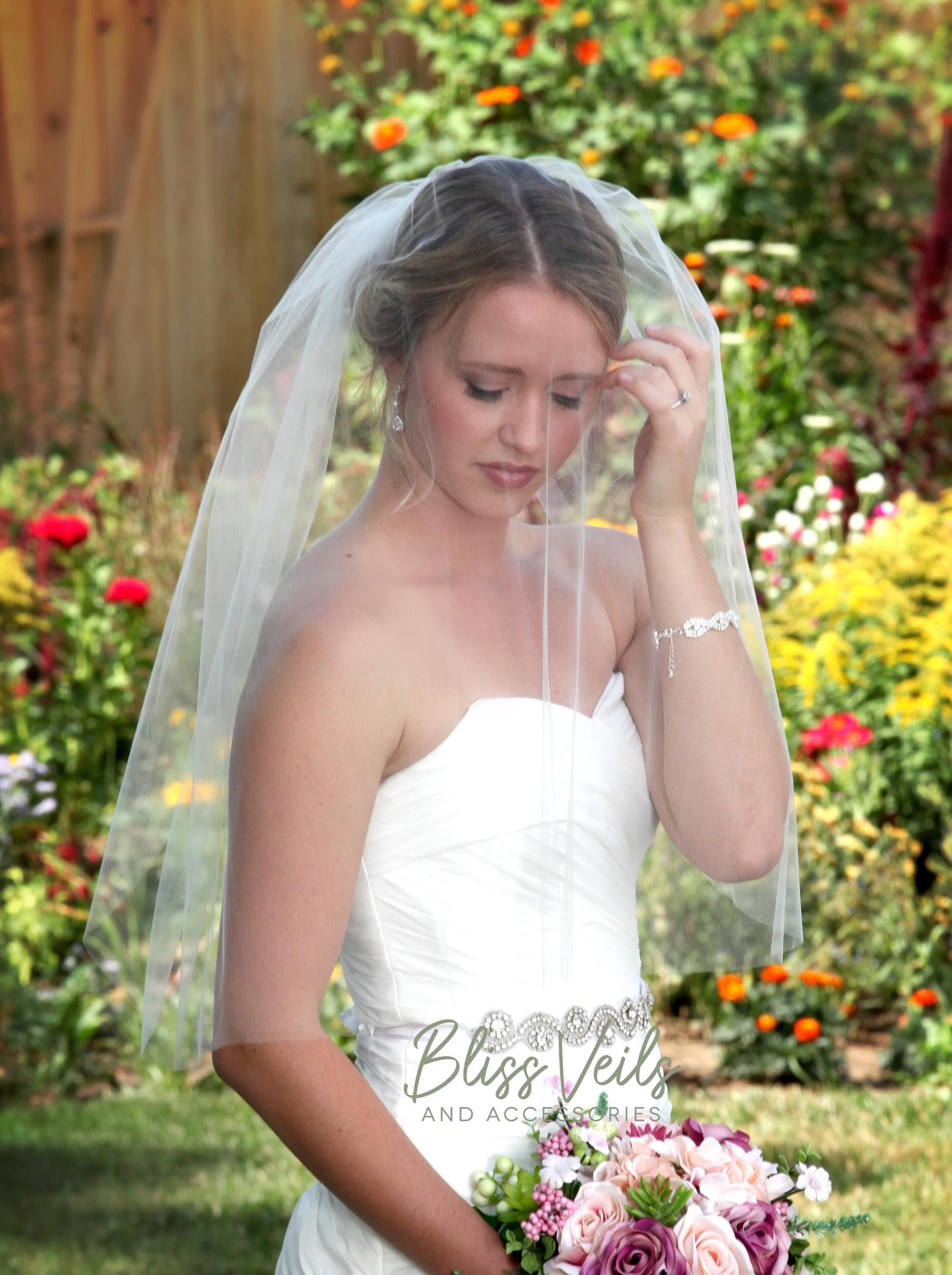 Raw edge blusher veil in soft tulle, 30 or 36 inches long, available in soft white, light ivory, pale blush, champagne, and more.