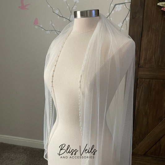 Cathedral length beaded wedding veil with pearls and crystals, one tier soft tulle veil in ivory or off white for an elegant bridal look.