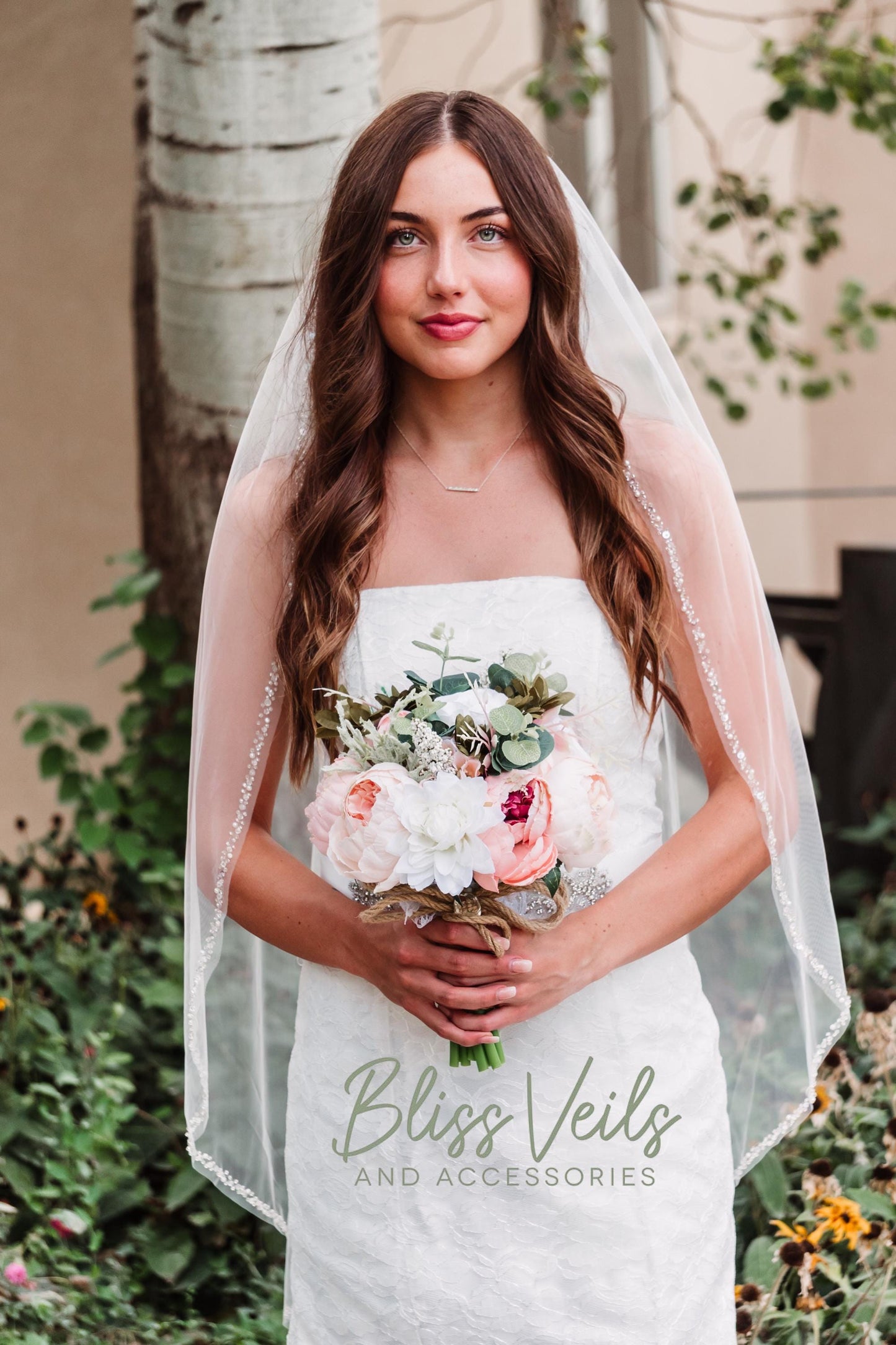 Elegant bridal veil with pearl and crystal trim, fingertip length