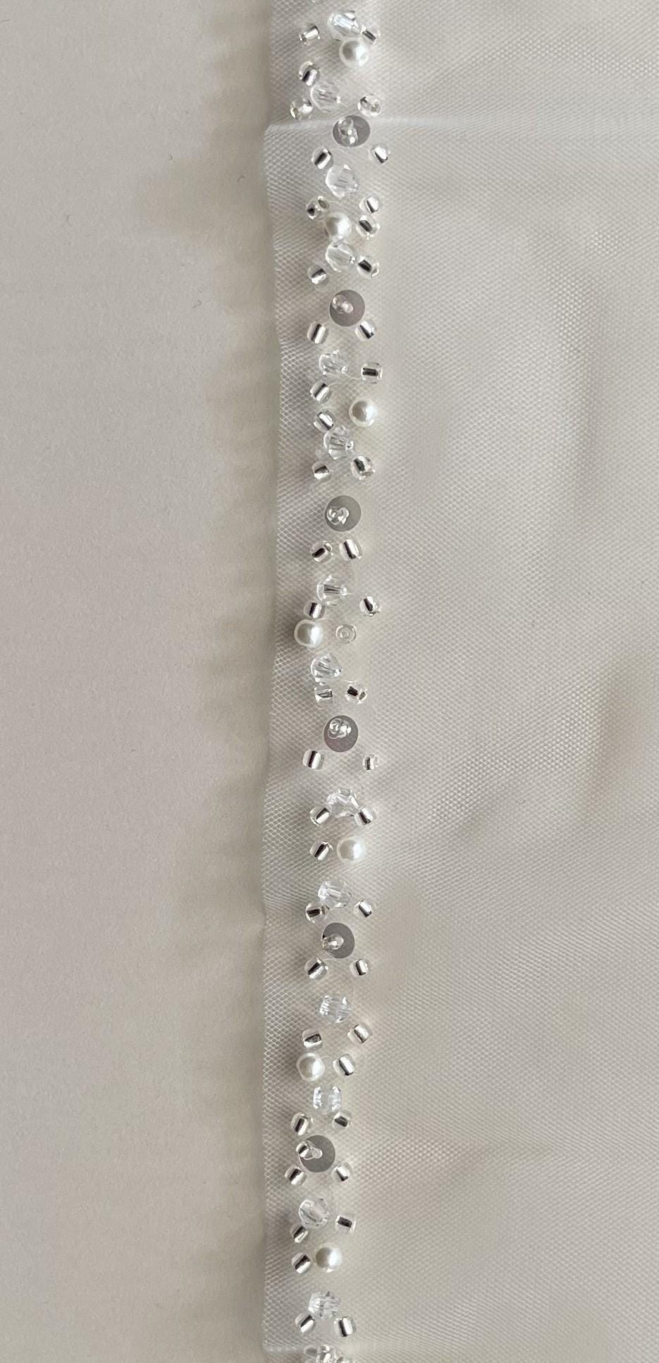 Cathedral length beaded veil with soft tulle and silver comb