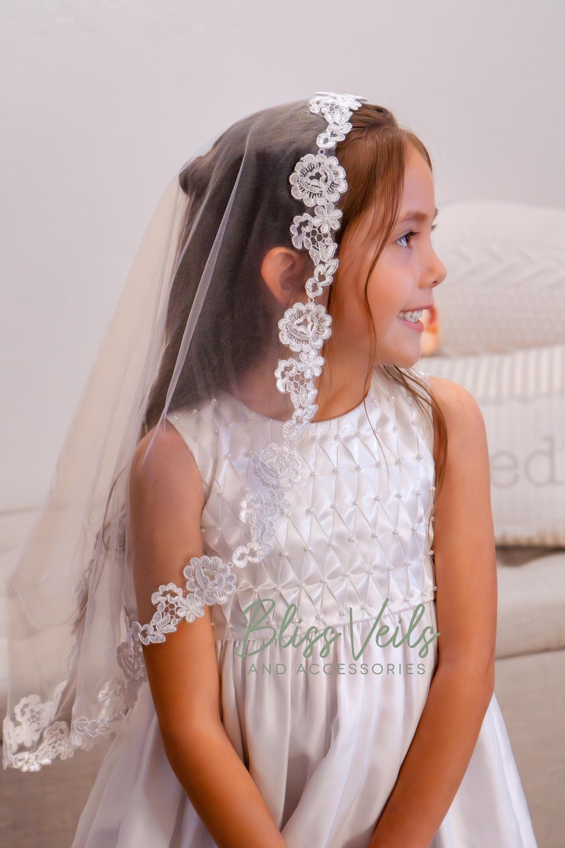 Floral lace First Communion mantilla veil in soft tulle with comb in bright white or soft white, shown in 25 inch length