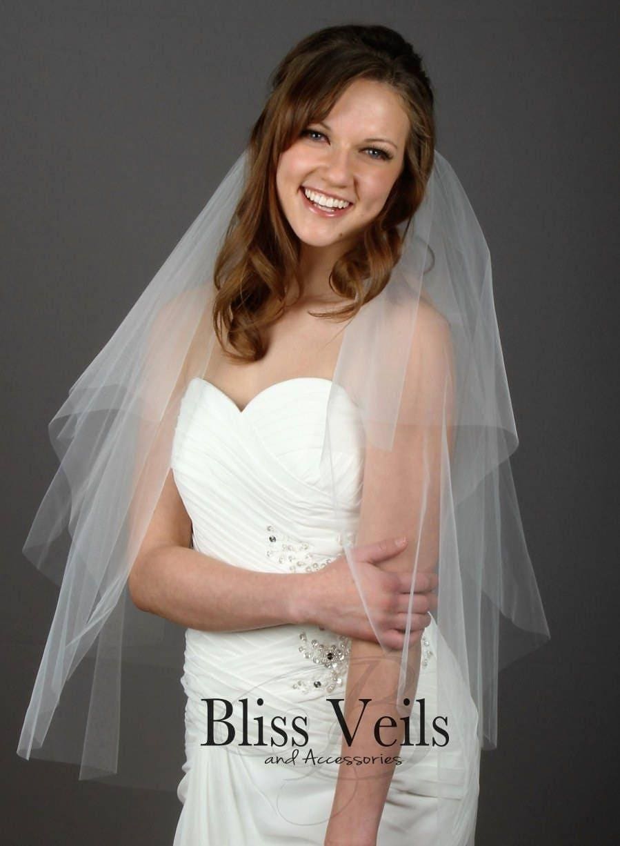 Lightweight ivory bridal veil with soft flowing blusher