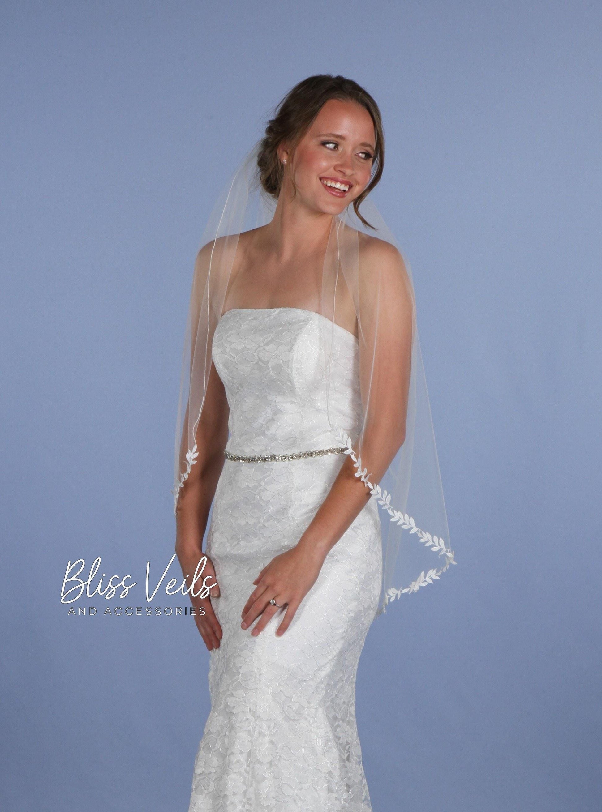 Light ivory chapel length leaf lace edge veil