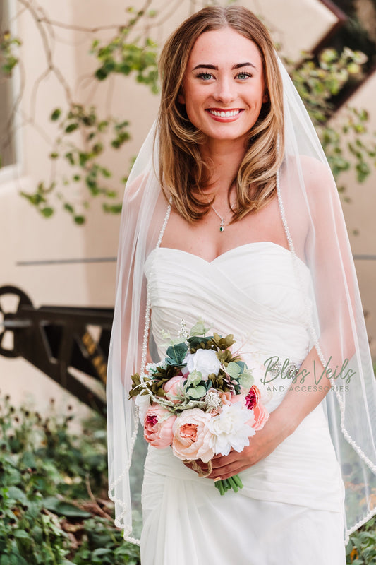 Pearl beading detail on soft tulle wedding veil
