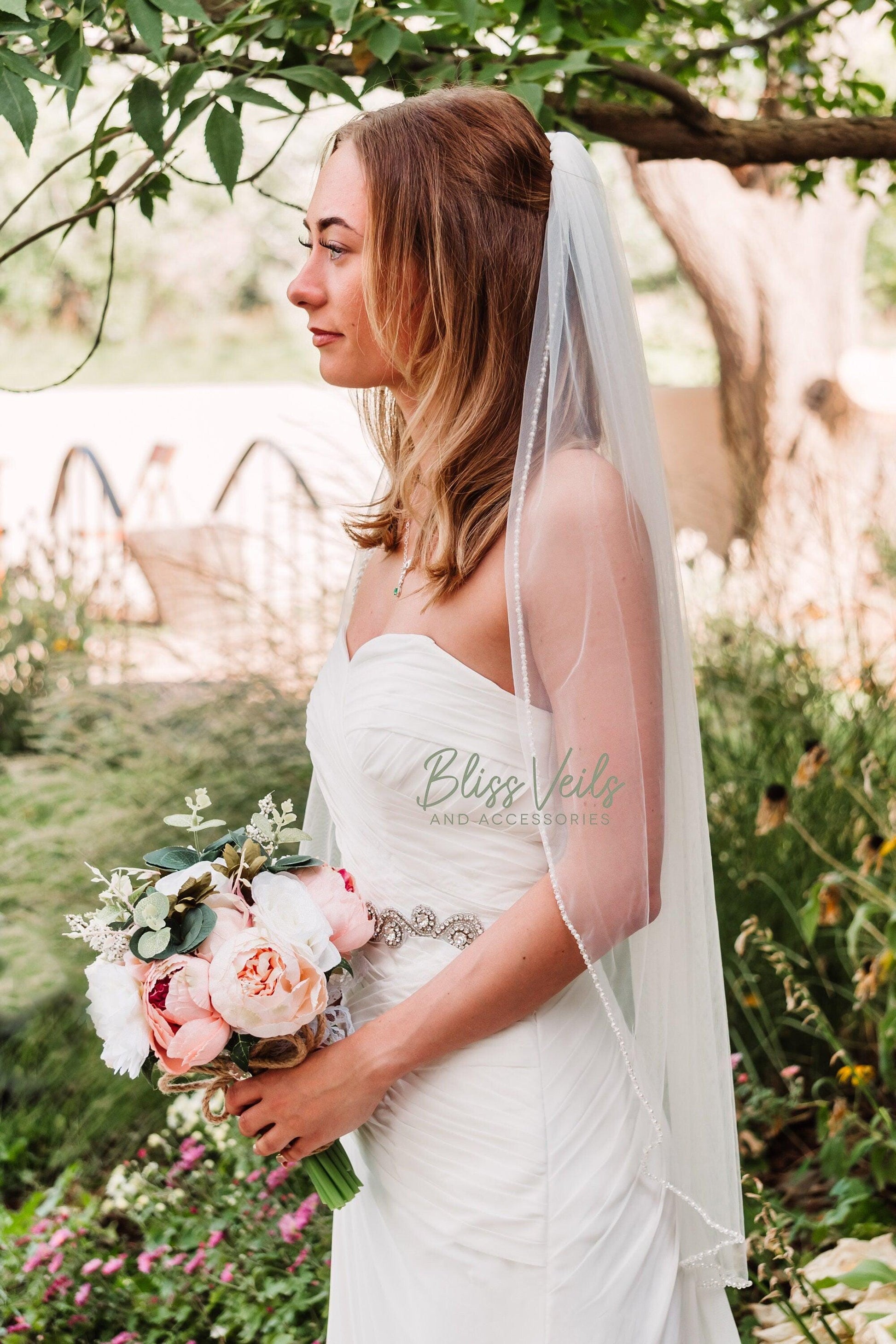 Crystal and pearl beaded wedding veil in ivory fingertip length