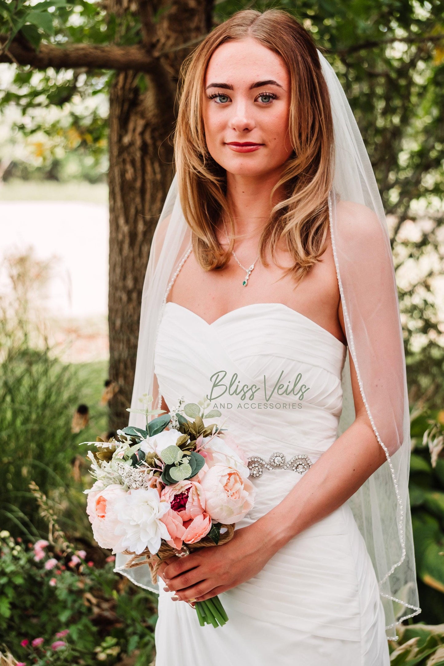 Soft tulle bridal veil with scattered pearls and crystals