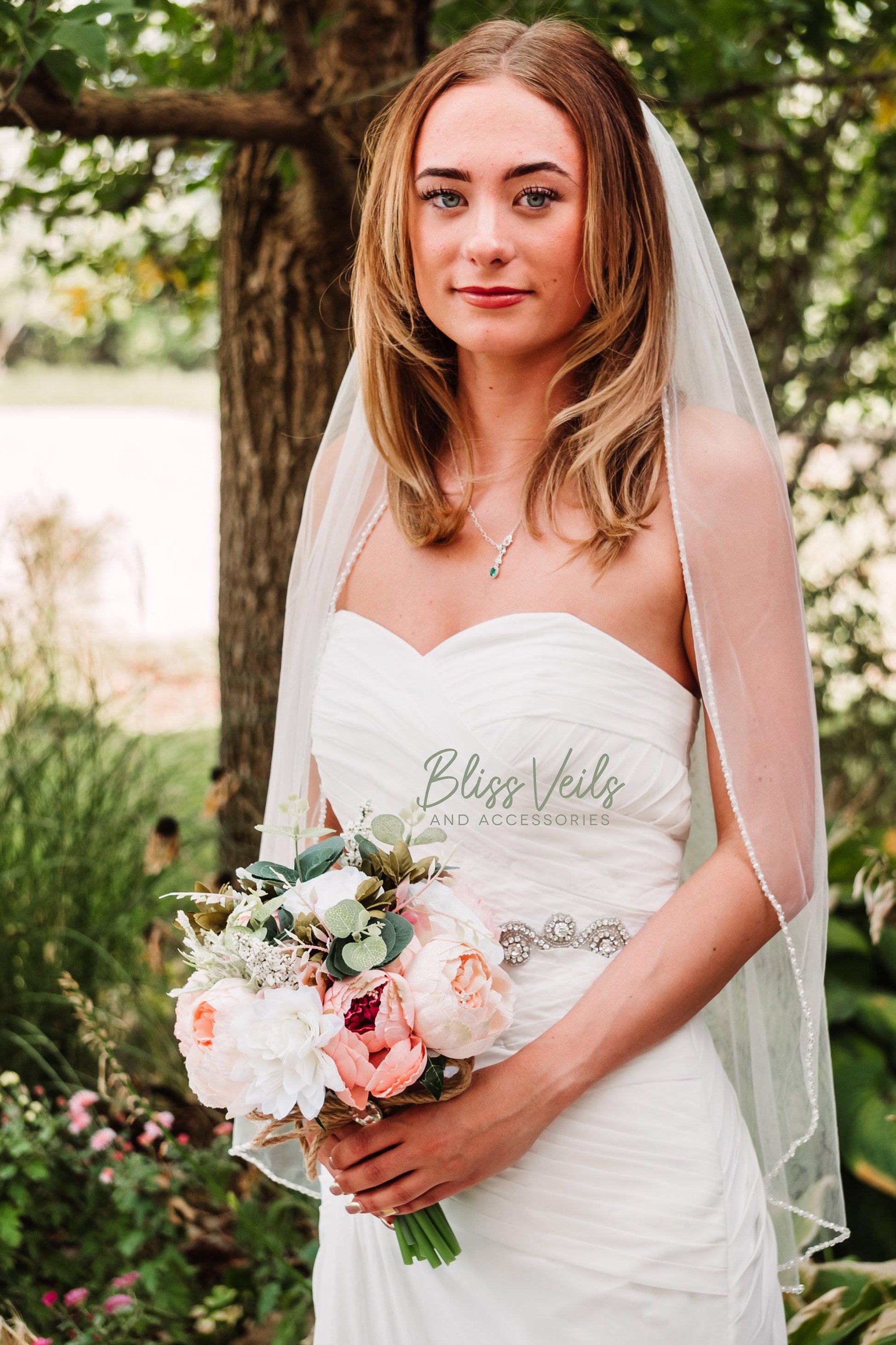 Soft tulle bridal veil with scattered pearls and crystals
