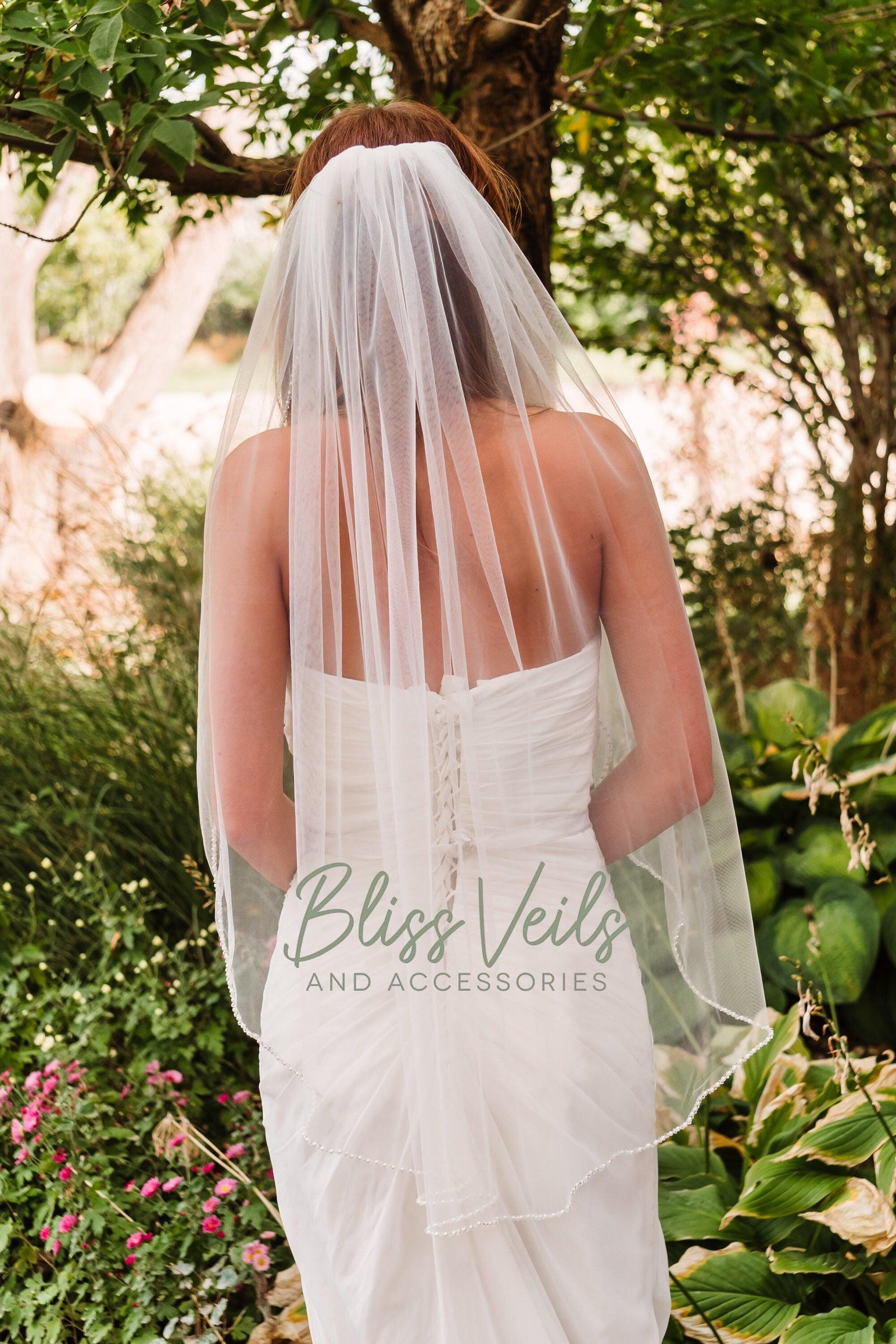 Ivory one-layer veil with pearl bead details and silver comb