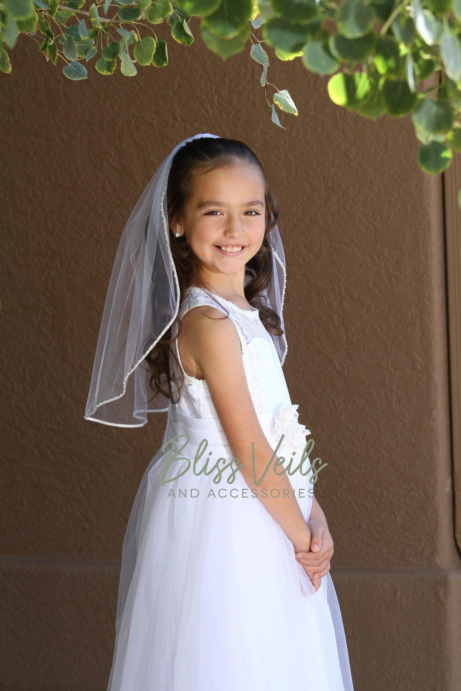 First Communion veil with pearls and rhinestones in bright white, soft white, or light ivory, available in 20” or 25” lengths