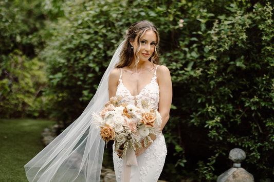 Sheer simple one tier wedding veil in soft tulle with a clean cut edge