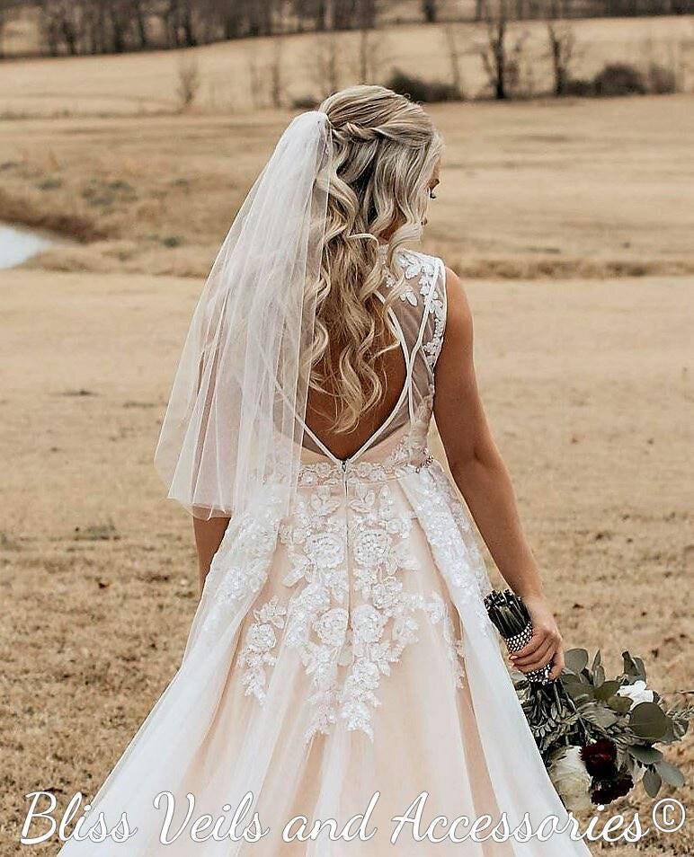 Minimal one tier sheer wedding veil with cut edge