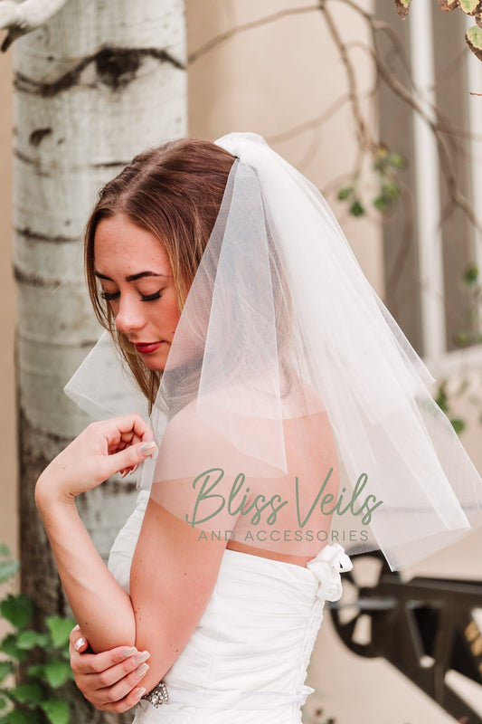 Two layer cut edge bridal veil shown in shoulder length