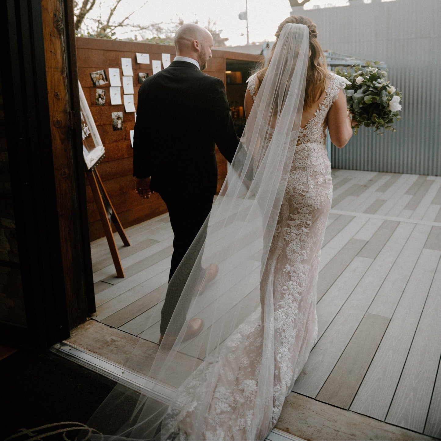 Simple sheer wedding veil with cut edge in soft white
Sheer cut edge wedding veil shown in chapel length
Simple sheer wedding veil with soft tulle drape